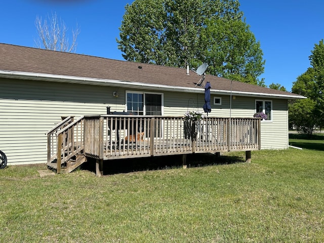900 Pleasant Ave S, Park Rapids, MN 56470 - rear view of house with a deck, a lawn, and a shingled roof