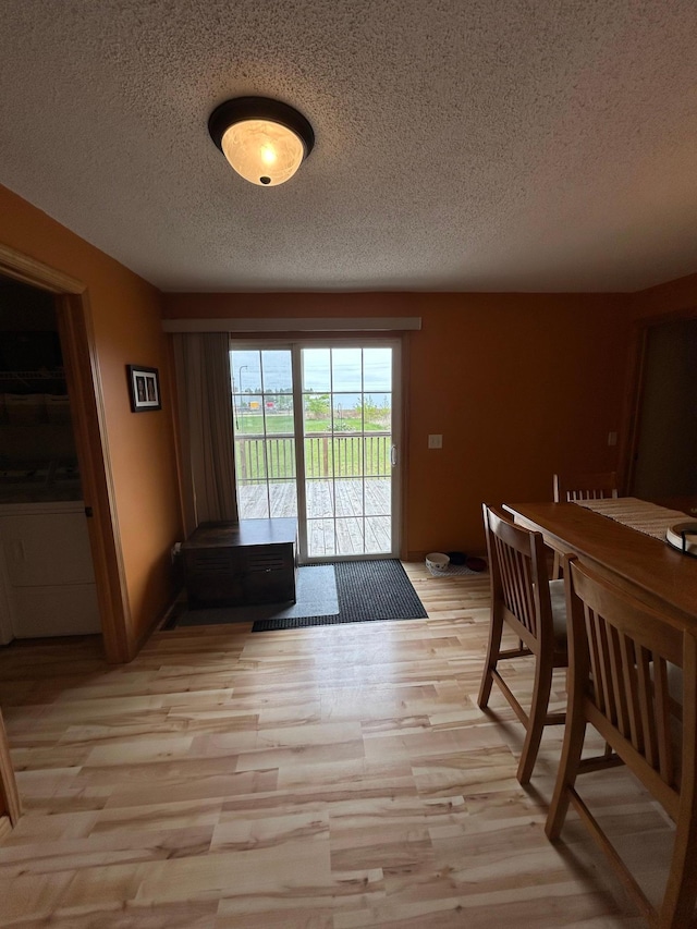 900 Pleasant Ave S, Park Rapids, MN 56470 - dining space with a textured ceiling and light wood-style floors