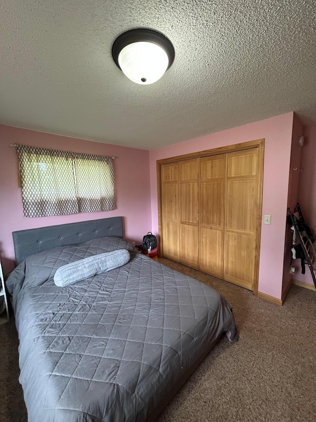 900 Pleasant Ave S, Park Rapids, MN 56470 - bedroom featuring a textured ceiling, a closet, and carpet flooring