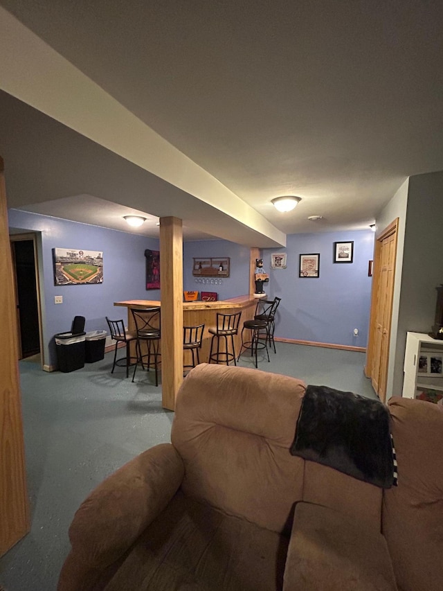 900 Pleasant Ave S, Park Rapids, MN 56470 - carpeted living room featuring bar and baseboards