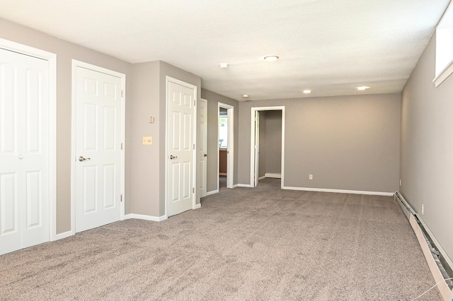 4020 Orleans Ln N, Plymouth, MN 55441 - unfurnished bedroom with a baseboard radiator, carpet flooring, baseboards, and recessed lighting