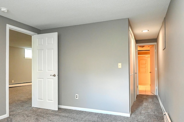 4020 Orleans Ln N, Plymouth, MN 55441 - unfurnished bedroom with baseboard heating, carpet flooring, and baseboards