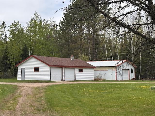5960 Evergreen Rd, Biwabik Twp, MN 55705 - view of front of house with a garage, a front yard, and an outdoor structure