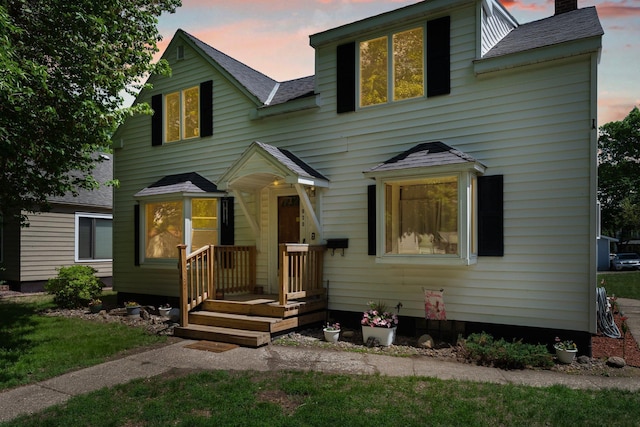 820 6th St, Montevideo, MN 56265 - traditional-style home featuring a shingled roof and a chimney
