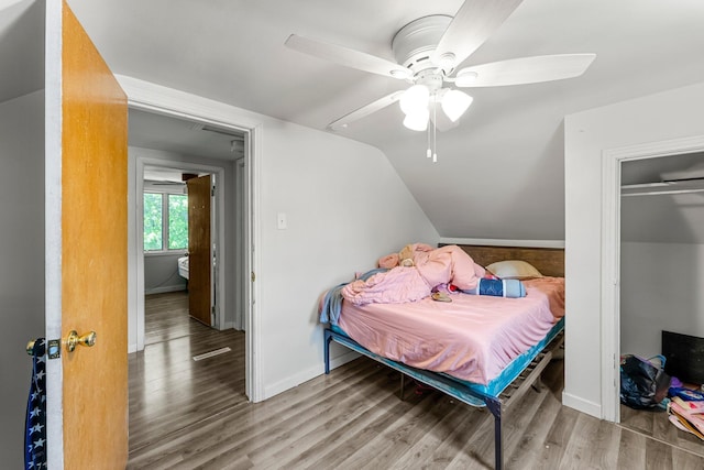 820 6th St, Montevideo, MN 56265 - bedroom with wood finished floors, lofted ceiling, baseboards, and ceiling fan