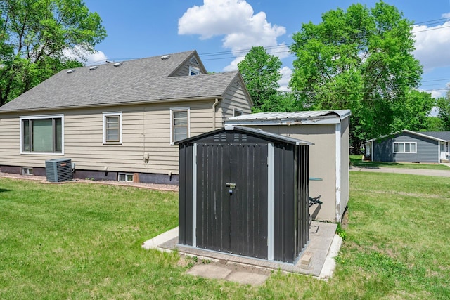 820 6th St, Montevideo, MN 56265 - rear view of property featuring a yard, cooling unit, and a shingled roof