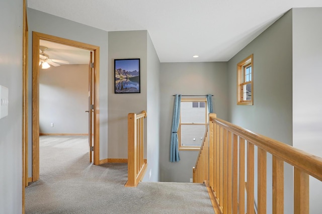 15285 Quinn St NW, Andover, MN 55304 - hallway featuring an upstairs landing, carpet flooring, and baseboards