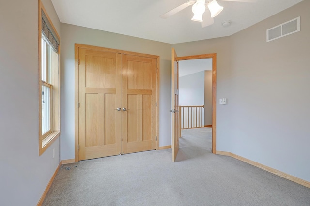 15285 Quinn St NW, Andover, MN 55304 - empty room with light colored carpet, ceiling fan, baseboards, and a smoke detector