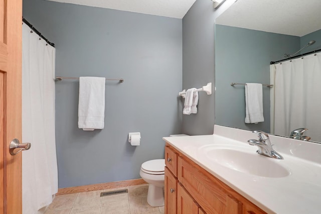 15285 Quinn St NW, Andover, MN 55304 - full bathroom with vanity, toilet, baseboards, tile patterned floors, and a shower with curtain