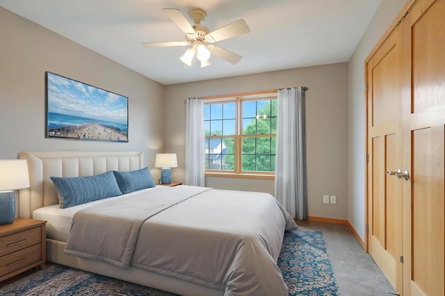 15285 Quinn St NW, Andover, MN 55304 - bedroom featuring light carpet, baseboards, and a ceiling fan