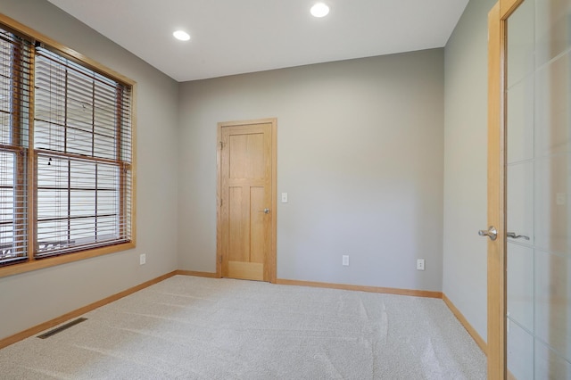 15285 Quinn St NW, Andover, MN 55304 - spare room with light carpet, baseboards, and recessed lighting