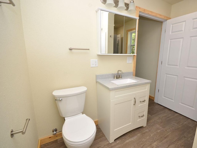 24061 US-71, Park Rapids, MN 56470 - bathroom featuring vanity, wood finished floors, and toilet