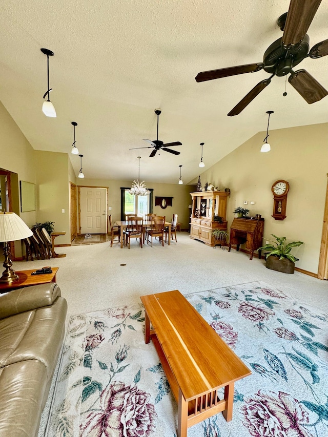 11777 State Highway 11 SE, Baudette, MN 56623 - living room featuring carpet floors, vaulted ceiling, ceiling fan, a textured ceiling, and baseboards