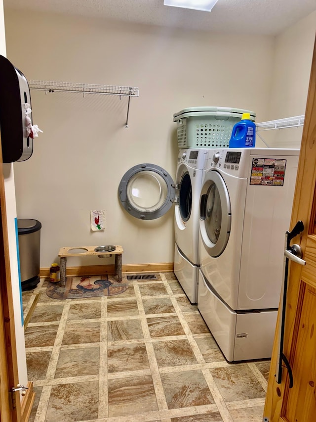 11777 State Highway 11 SE, Baudette, MN 56623 - laundry area featuring washer and clothes dryer and baseboards