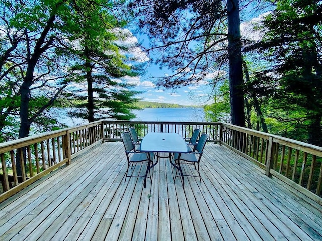 6974 Bankers Dr, Minong, WI 54859 - wooden terrace with outdoor dining area and a water view