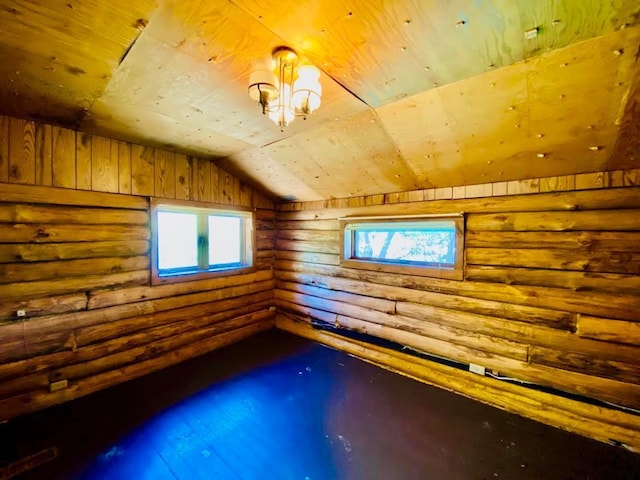 6974 Bankers Dr, Minong, WI 54859 - spare room featuring log walls, wooden ceiling, and vaulted ceiling