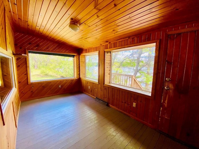 6974 Bankers Dr, Minong, WI 54859 - unfurnished sunroom with plenty of natural light and a baseboard heating unit