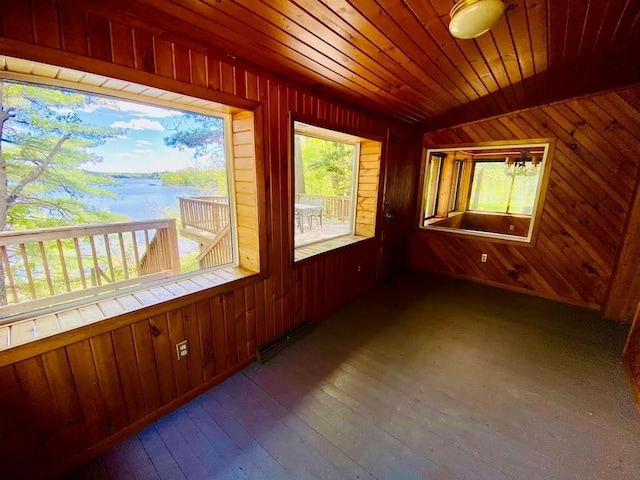 6974 Bankers Dr, Minong, WI 54859 - unfurnished sunroom featuring a water view and a baseboard radiator