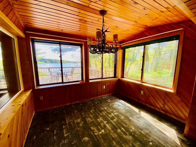6974 Bankers Dr, Minong, WI 54859 - unfurnished sunroom featuring a chandelier, vaulted ceiling, and a water view