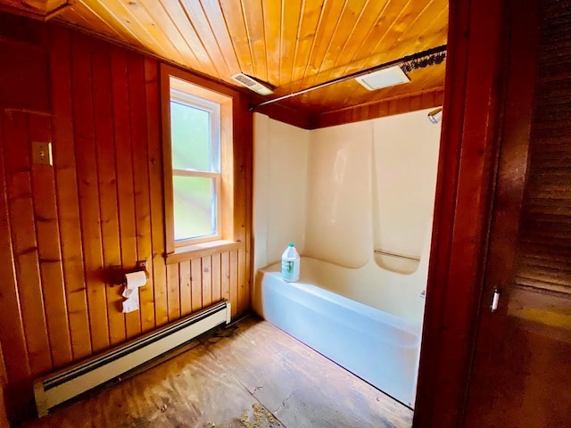 6974 Bankers Dr, Minong, WI 54859 - bathroom with a baseboard heating unit, wood ceiling, wood walls, and shower / bath combination