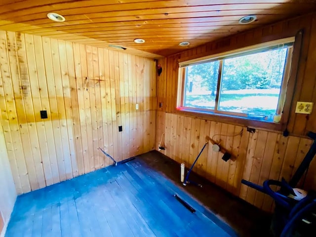6974 Bankers Dr, Minong, WI 54859 - unfurnished room featuring wooden ceiling, wooden walls, hardwood / wood-style floors, and recessed lighting