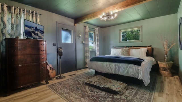 N10221 970th St, Grant Twp, WI 54730 - bedroom featuring wood finished floors, beam ceiling, and wooden walls
