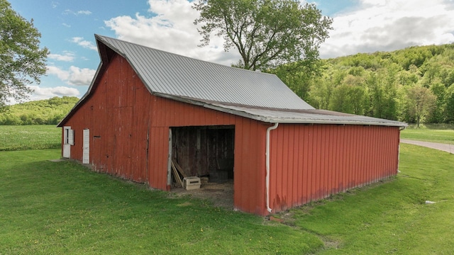 N10221 970th St, Grant Twp, WI 54730 - view of barn with a lawn and a view of trees