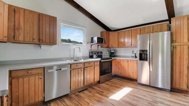 N10221 970th St, Grant Twp, WI 54730 - kitchen featuring appliances with stainless steel finishes, a sink, light wood finished floors, and light countertops