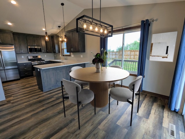 26884 709th St, Lake City, MN 55041 - dining area featuring vaulted ceiling, dark wood-style floors, recessed lighting, and baseboards