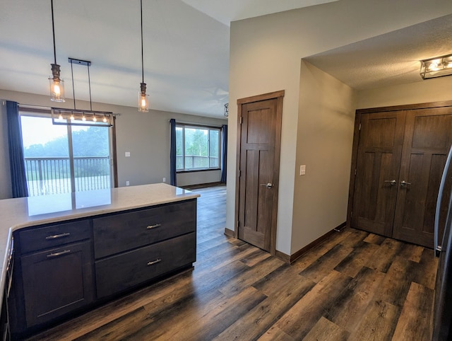 26884 709th St, Lake City, MN 55041 - kitchen with dark wood-style flooring, light countertops, baseboards, and hanging light fixtures