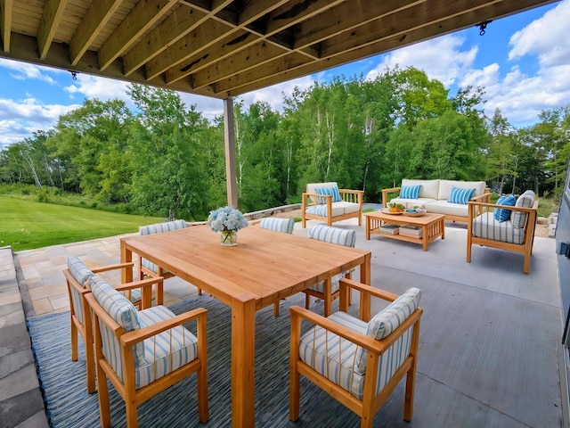 26884 709th St, Lake City, MN 55041 - view of patio featuring an outdoor living space, outdoor dining area, and view of wooded area