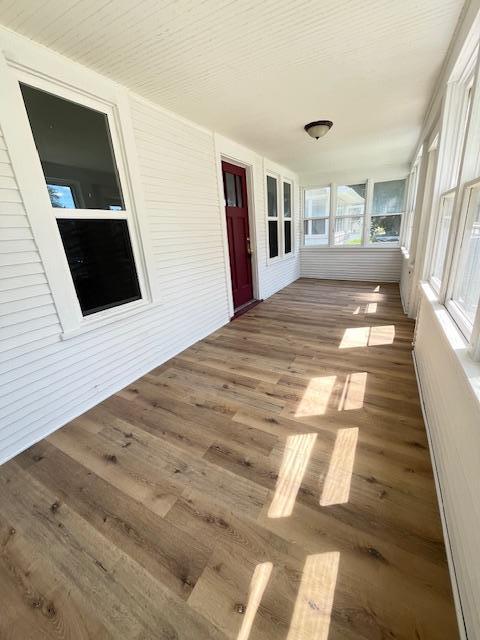 1269 Margaret St, Saint Paul, MN 55106 - unfurnished sunroom featuring wood finished floors