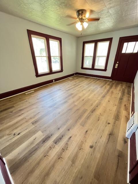 1269 Margaret St, Saint Paul, MN 55106 - foyer featuring a ceiling fan, wood finished floors, and baseboards