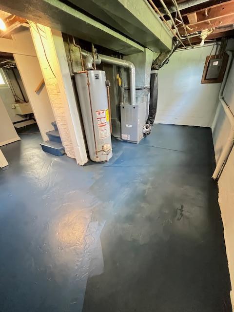 1269 Margaret St, Saint Paul, MN 55106 - unfinished basement with gas water heater, electric panel, stairs, and heating unit