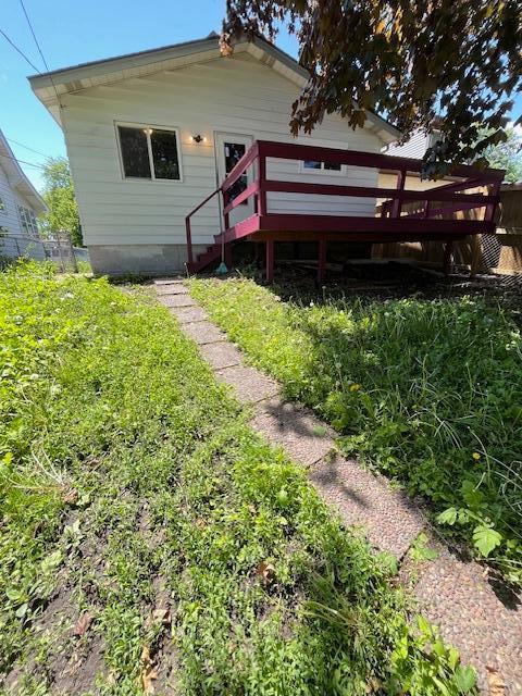 1269 Margaret St, Saint Paul, MN 55106 - back of house with a wooden deck