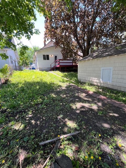 1269 Margaret St, Saint Paul, MN 55106 - view of yard featuring a deck