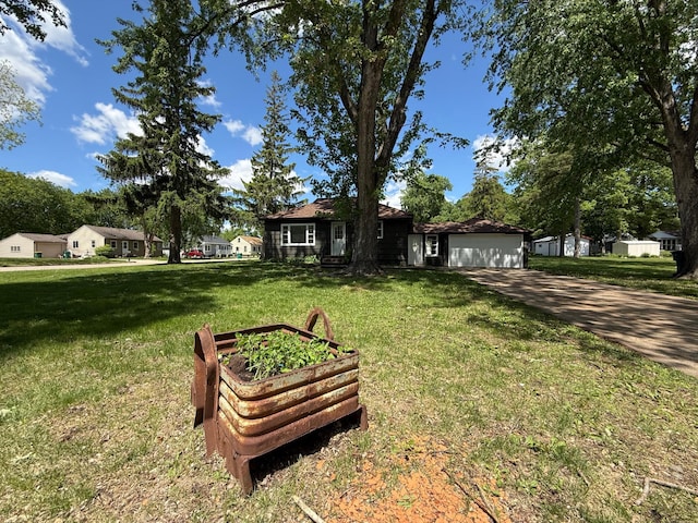 446 Darwin St, Litchfield, MN 55355 - ranch-style house with an attached garage, driveway, and a front lawn