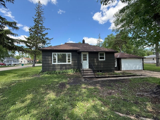 446 Darwin St, Litchfield, MN 55355 - view of front of home featuring a front lawn, a chimney, and driveway