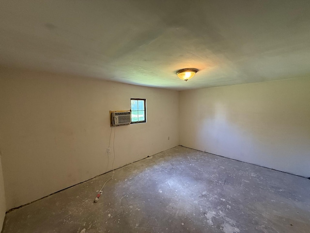 446 Darwin St, Litchfield, MN 55355 - empty room with unfinished concrete floors and a wall unit AC