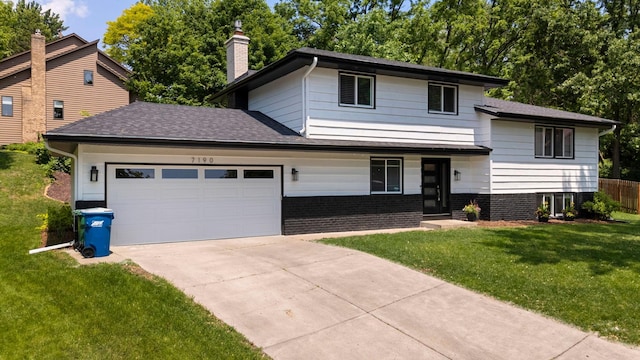 7190 Annapolis Cir, Maple Grove, MN 55311 - tri-level home featuring a garage, a chimney, concrete driveway, brick siding, and a shingled roof