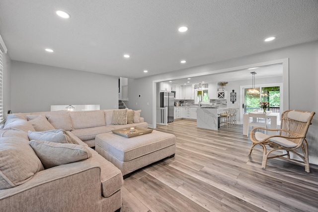 7190 Annapolis Cir, Maple Grove, MN 55311 - living area featuring recessed lighting, light wood finished floors, and stairs
