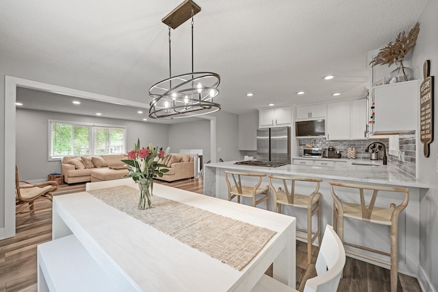 7190 Annapolis Cir, Maple Grove, MN 55311 - dining room featuring wood finished floors, recessed lighting, and a chandelier