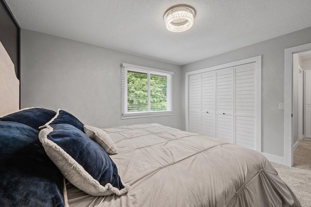 7190 Annapolis Cir, Maple Grove, MN 55311 - bedroom with carpet, a closet, a textured ceiling, and baseboards