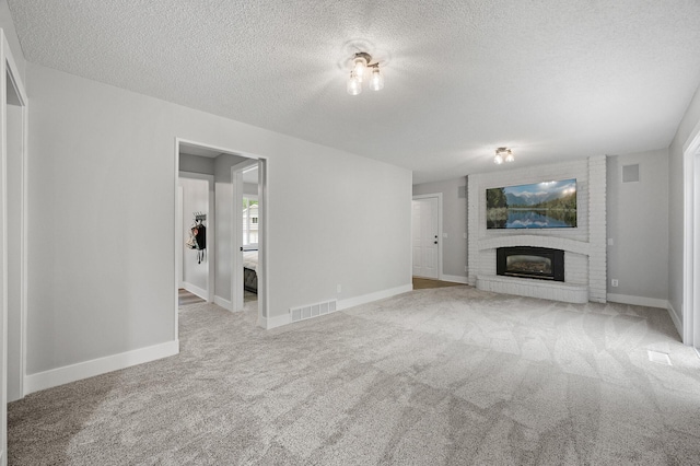 7190 Annapolis Cir, Maple Grove, MN 55311 - unfurnished living room featuring carpet floors, a fireplace, a textured ceiling, and baseboards