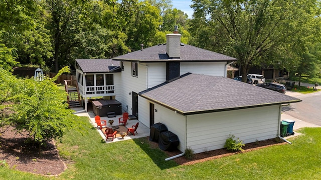 7190 Annapolis Cir, Maple Grove, MN 55311 - back of house featuring a shingled roof, a chimney, a hot tub, a patio area, and a sunroom