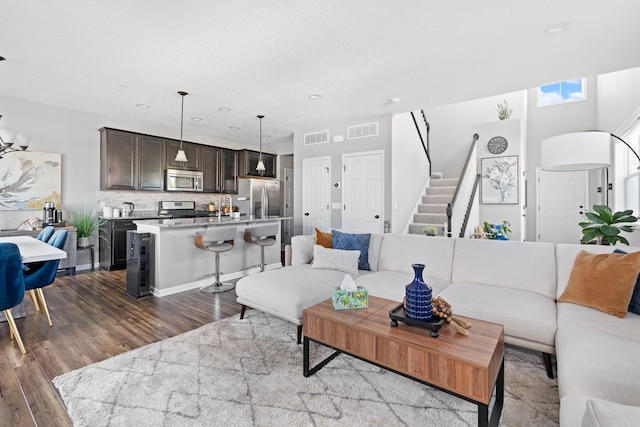 6980 Archer Trl, Inver Grove Heights, MN 55077 - living room with dark wood-style floors, stairway, and recessed lighting
