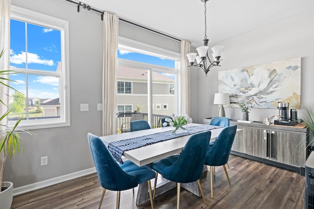 6980 Archer Trl, Inver Grove Heights, MN 55077 - dining space with a chandelier, dark wood-style floors, and baseboards