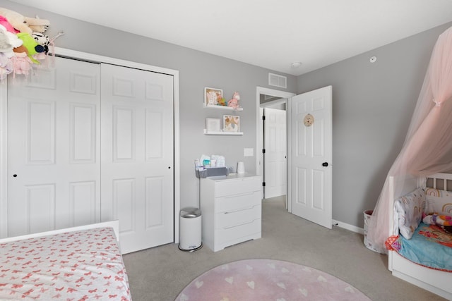 6980 Archer Trl, Inver Grove Heights, MN 55077 - bedroom with light colored carpet, a closet, and baseboards