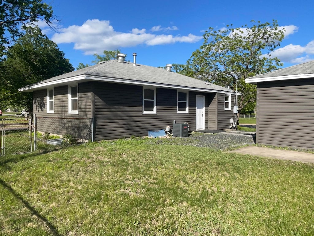 600 115th Ave NW, Coon Rapids, MN 55448 - back of house featuring central AC