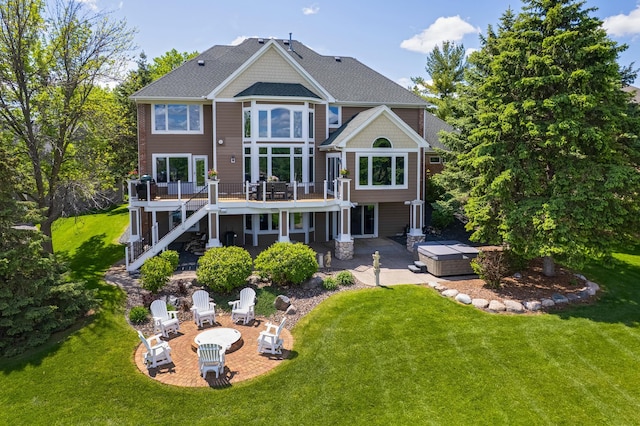3877 Fairway Dr, Woodbury, MN 55125 - back of property with a hot tub, a patio, an outdoor fire pit, and stairway